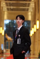 A young person in a suit

Description automatically generated, Picture