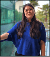 A person standing next to a glass building

Description automatically generated, Picture