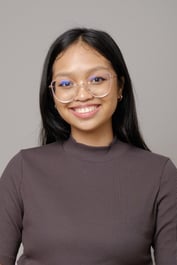 A person wearing glasses and smiling
Description automatically generated, Picture