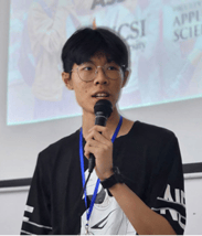 A person speaking into a microphone

Description automatically generated, Picture